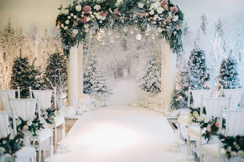 Snowy winter wedding wonderland aisle
