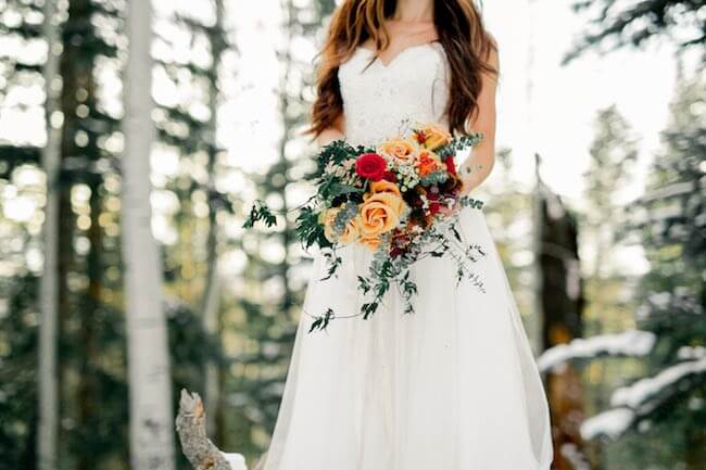 Winter wedding bouquet with touch of colour