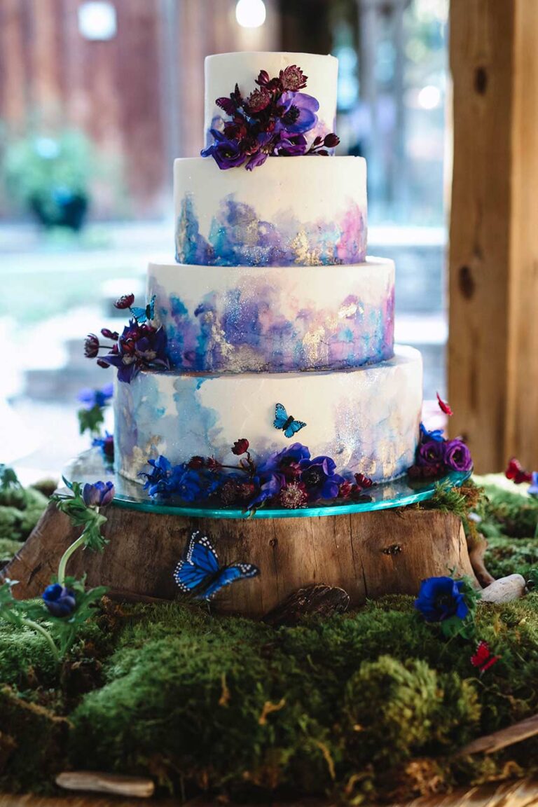 Wedding trends 2026 - handpainted cake with foraged woodland accents